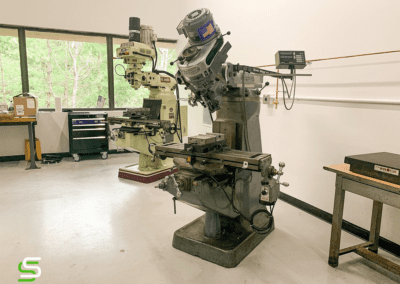 Two Milling Machines in a machine shop
