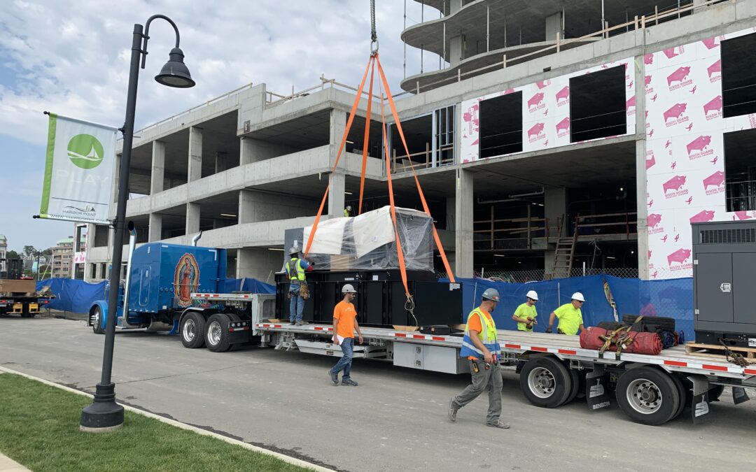 Commercial Generator being lifted off flatbed